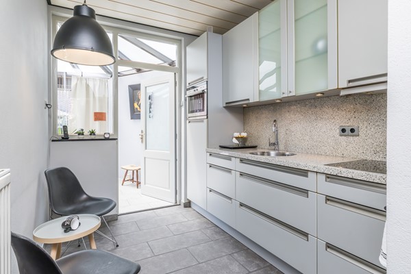 Foto - Verkocht onder voorbehoud: Nette twee- onder- een – kapwoning met serre, zonnige tuin en garage in Bocholtz